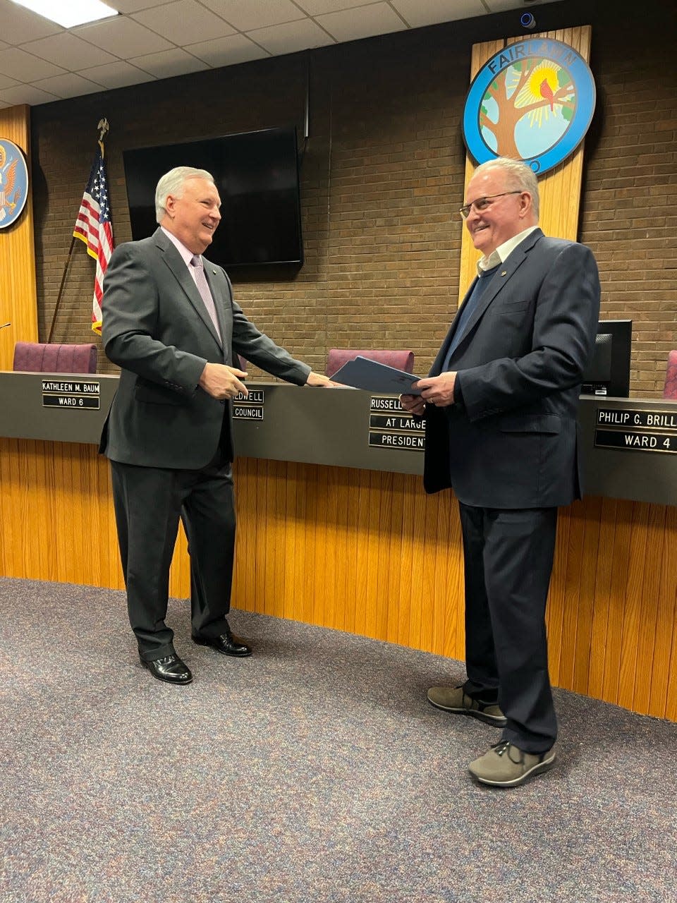 Russell Sharnsky, left, officially becomes Fairlawn's new mayor Thursday after being sworn in Monday by retiring Mayor William Roth.