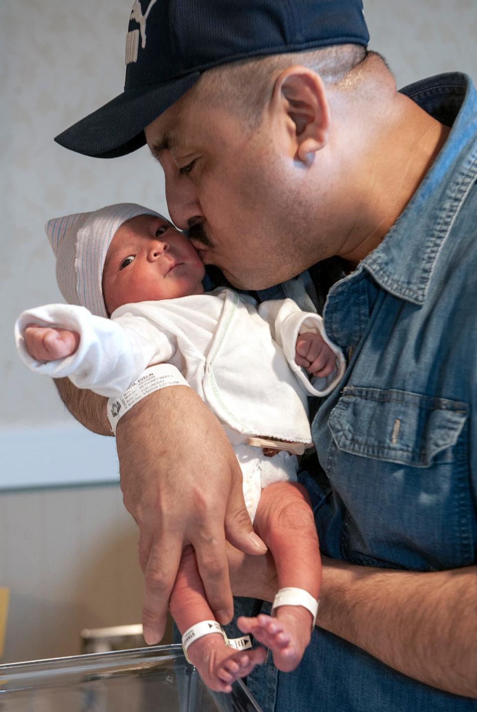 Erick Garcia, of Marlborough, holds his daughter, Erelin Darianna Garcia, who was born at 3:27 a.m. on Jan. 1, the first baby born in MetroWest in 2024.