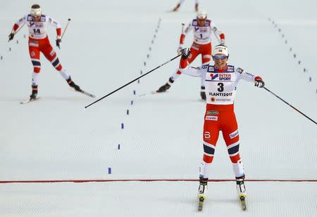 FIS Nordic Ski World Championships - Women's Cross-Country 30 km Mass Start Free - Lahti, Finland - 4/3/17 - Norway's Marit Bjoergen celebrates crossing the finnish line. REUTERS/Kai Pfaffenbach