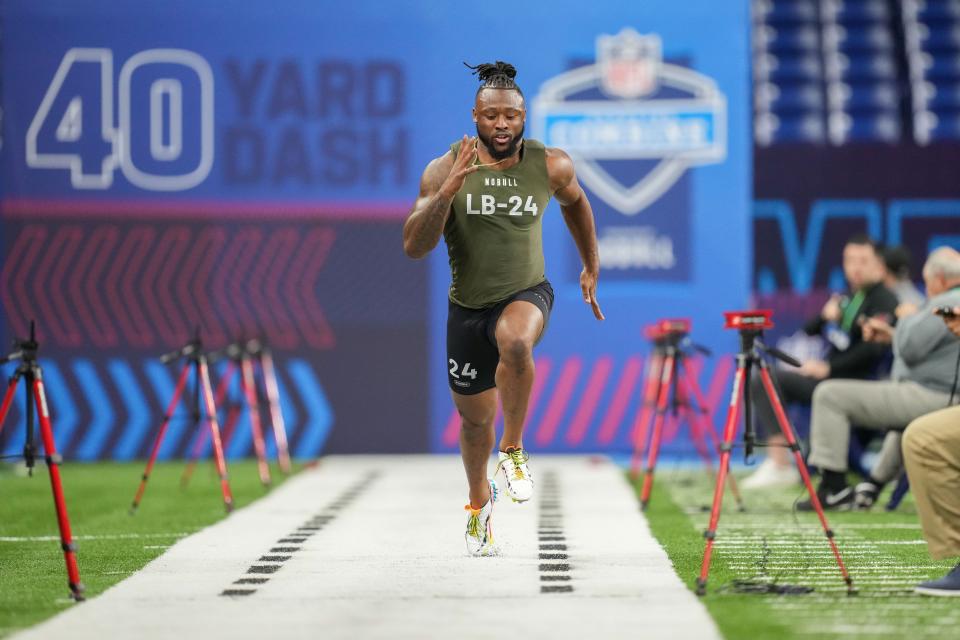 Auburn linebacker Owen Pappoe runs the 40-yard dash. Pappoe had the fastest time among linebackers at 4.39 seconds.