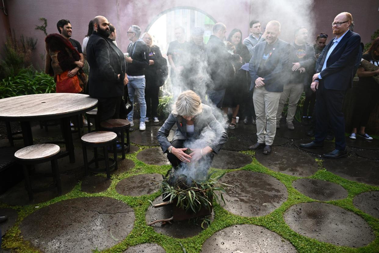 <span>Members of the Yoorrook Justice Commission and guests take part in a smoking ceremony.</span><span>Photograph: Joel Carrett/AAP</span>