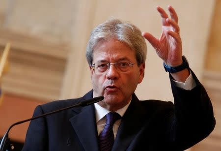 Italian Foreign Minister Paolo Gentiloni gestures as he talks during a joint press conference with Russian Foreign Minister Sergei Lavrov in Rome, Italy December 2, 2016. REUTERS/Remo Casilli