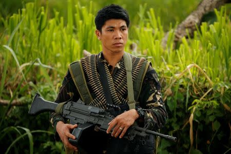 A Philippines army soldier guards a road during an operation to retrieve bodies of victims from the fighting zone in Marawi City, Philippines June 28, 2017. REUTERS/Jorge Silva