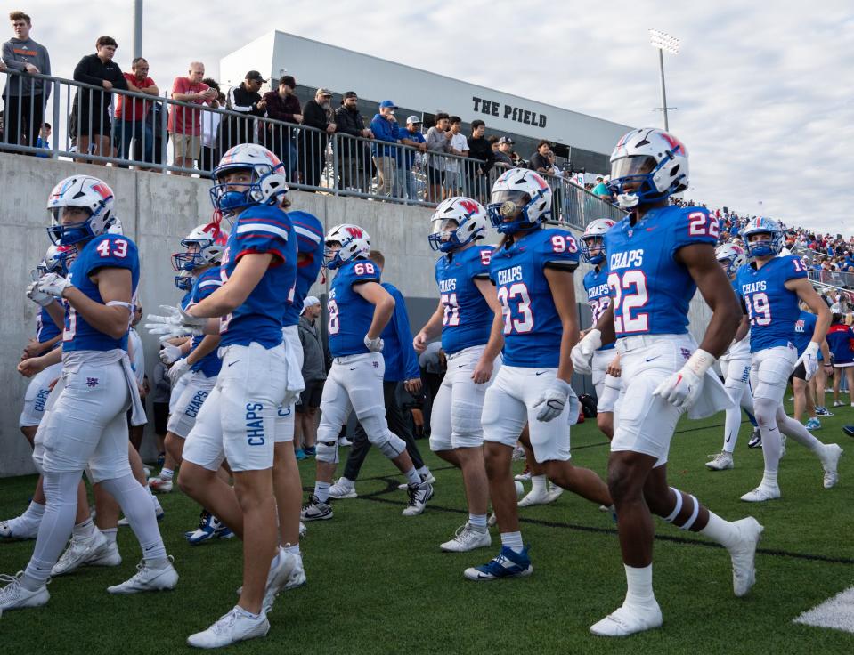 Westlake players head to the locker room at halftime during Saturday's 23-14 loss to Galena Park North Shore in the Class 6A state semifinals. The Chaparrals will lose a program-record 61 seniors but should be strong again in 2024.