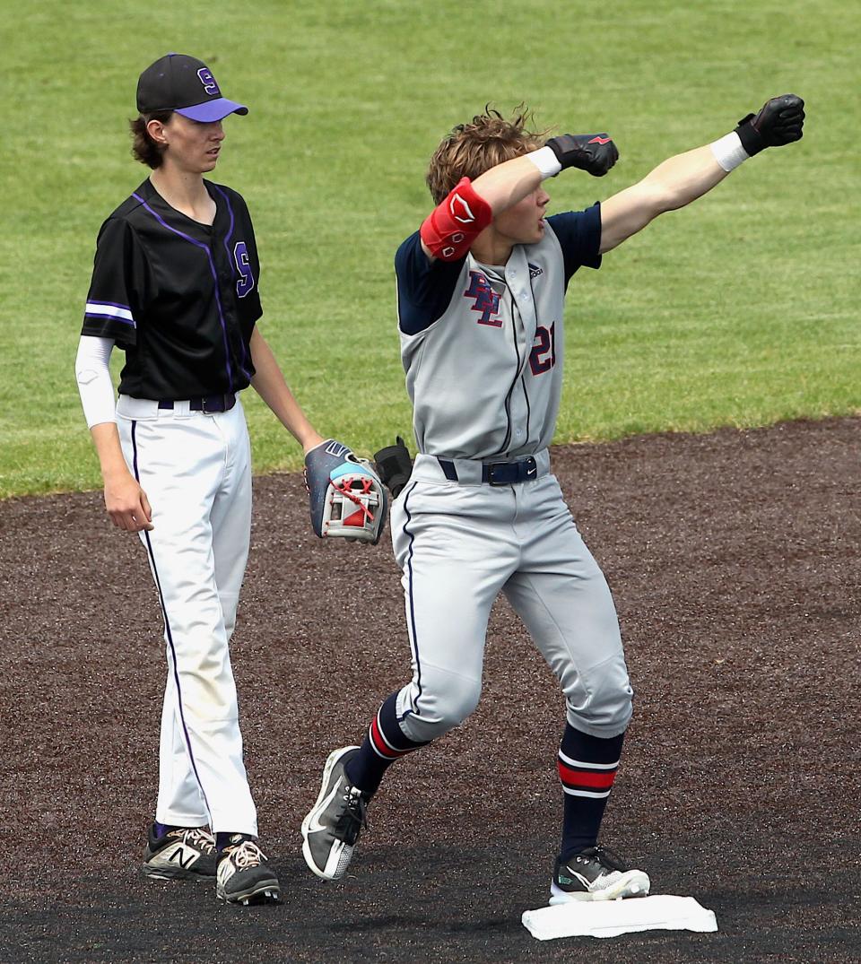 Bedford North Lawrence's Cal Gates (21) celebrates BNL's first run during the sectional semi-final game with Seymour on Saturday, May 28, 2022 at Jennings County.