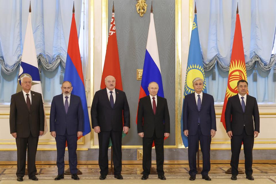 In this handout photo released by Roscongress Foundation, from left; Mikhail Myasnikovich, chairman of the Board of the Eurasian Economic Commission, Armenia's Prime Minister Nikol Pashinyan, Belarus' President Alexander Lukashenko, Russia's President Vladimir Putin, Kazakhstan's President Kassym-Jomart Tokayev and Kyrgyzstan's President Sadyr Japarov pose for a photo during a meeting of the Supreme Eurasian Economic Council at the Kremlin in Moscow, Russia, on Thursday, May 25, 2023. (Vyacheslav Viktorov, Roscongress Foundation via AP)