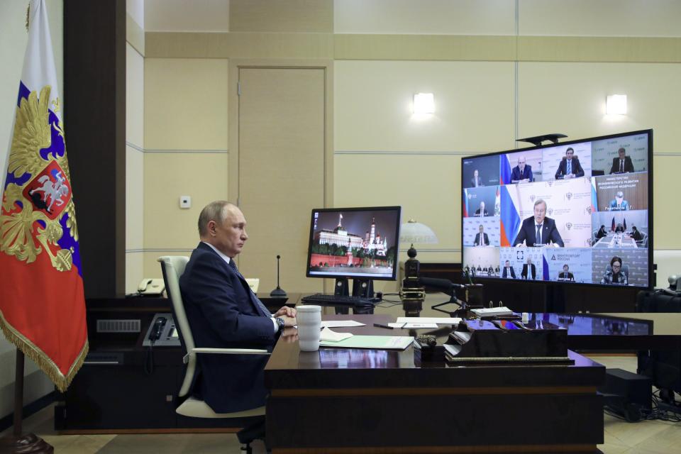 Russian President Vladimir Putin attends a meeting with top officials on support to aviation industry in Russia amid western sanctions vis videoconference at the Novo-Ogaryovo residence outside Moscow, Russia, Thursday.