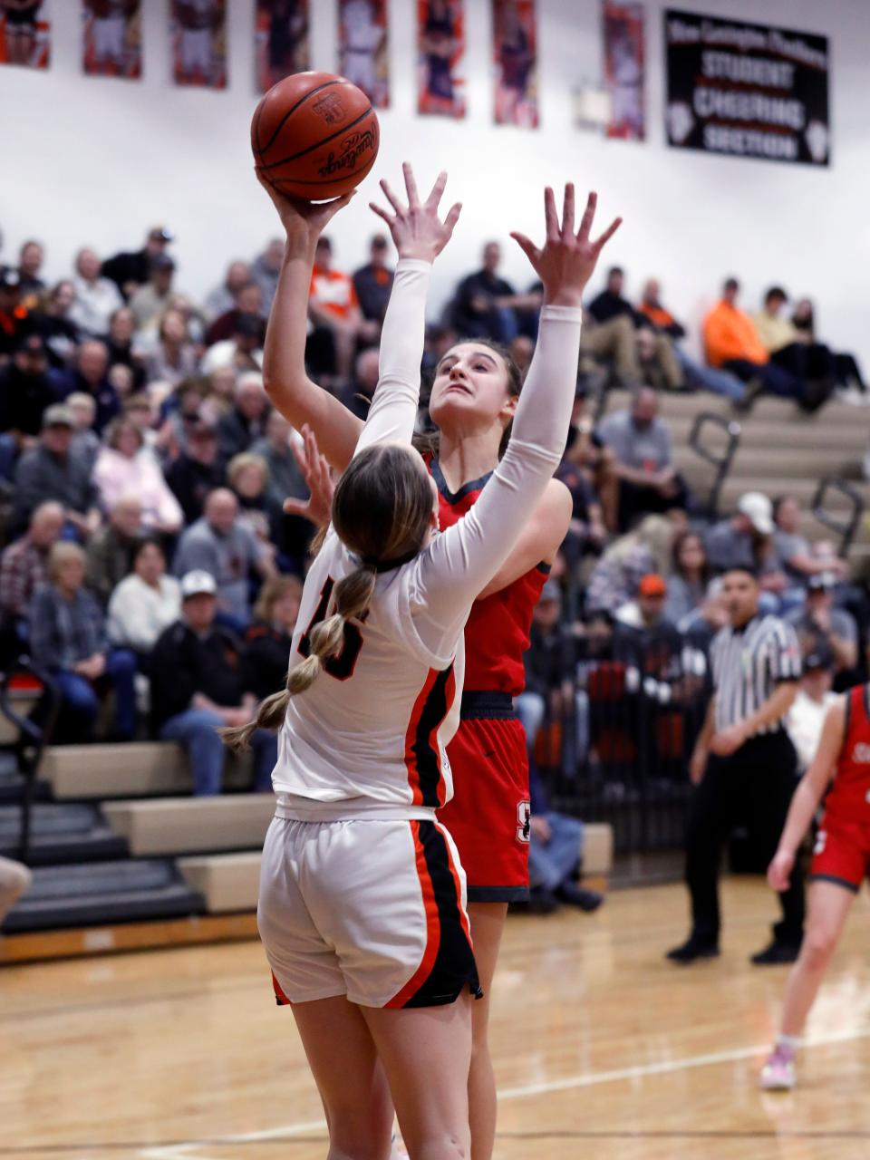 Sheridan's Nora Saffell shoots over New Lexington's Chloe Dick against New Lexington last season. Saffell and fellow senior Jamisyn Stinson lead the Generals, who should remain a force in the MVL and the Southeast District.