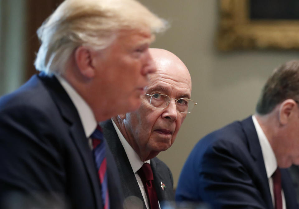 Commerce Secretary Wilbur Ross, right, listens as President Donald Trump speaks  in the Cabinet Room at the White House, Monday, Aug. 27, 2018, in Washington. (AP Photo/Alex Brandon)