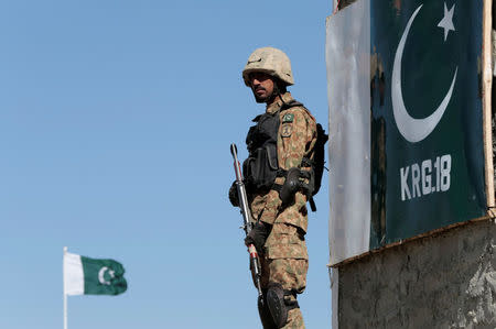 A soldier stands guard at the Angoor Adda outpost along the border fence on the border with Afghanistan in South Waziristan, Pakistan October 18, 2017. REUTERS/Caren Firouz