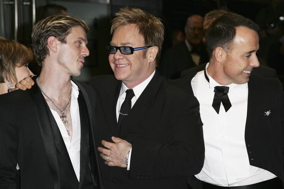 LONDON - NOVEMBER 14:  Elton John  David Furnish (R) and Jake Shears attend the Royal Premiere for the 21st James Bond film 'Casino Royale' at the Odeon Leicester Square on November 14, 2006 in London.  (Photo by Gareth Cattermole/Getty Images)