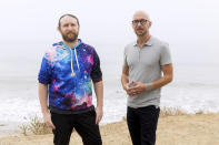 Author Neil Strauss, right, and Incubus guitarist Mike Einziger, of the podcast "To Live and Die in LA," pose for a portrait on Thursday, June 17, 2021, in Malibu, Calif. Strauss is back with a second season of his podcast, focusing on the 2017 disappearance of Elaine Park, a 20-year-old woman last seen in Calabasas, California. (Photo by Willy Sanjuan/Invision/AP)