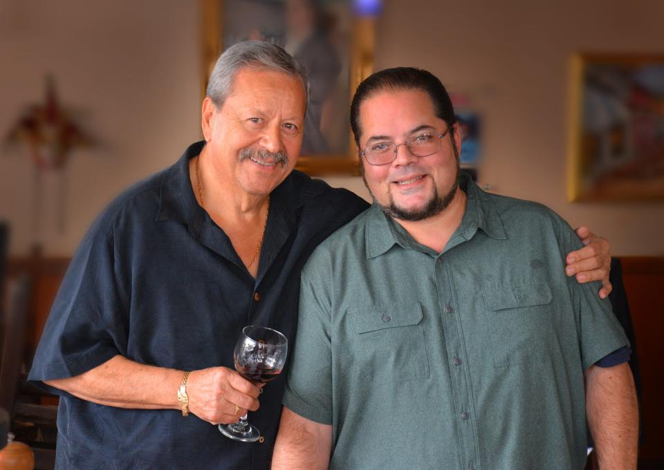 Pictured in a December 2019 photo are owners of The Dove III: John Mattiello, left, helmed the kitchen, while his son Carlo Mattiello greeted guests in the dining room.