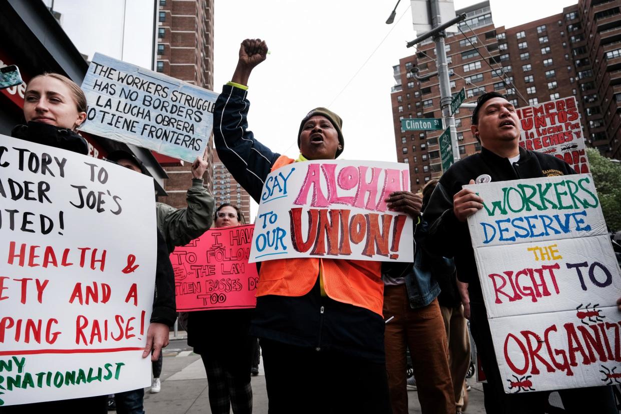 <span>Trader Joe’s employees rally in lower Manhattan in support of forming a union on 18 April 2023.</span><span>Photograph: Spencer Platt/Getty Images</span>