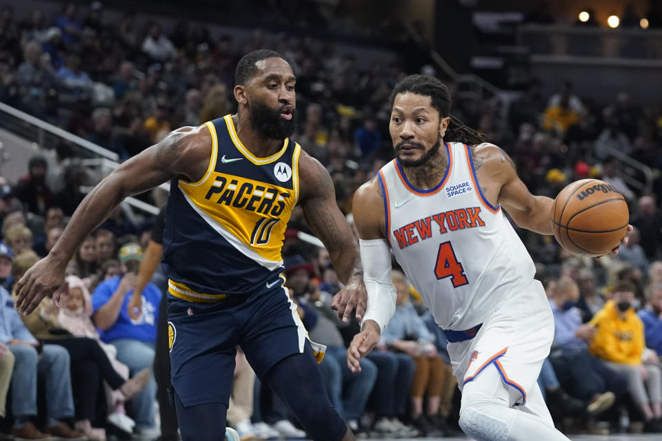 New York Knicks' Derrick Rose (4) goes to the basket against Indiana Pacers' Brad Wanamaker (10) during the first half of an NBA basketball game Wednesday, Dec. 8, 2021, in Indianapolis. (AP Photo/Darron Cummings)