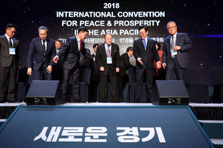 North Korean Ri Jong-hyok, vice chairman of the Korean Asia-Pacific Peace Committee, Lee Jae-myung, Gyeonggi province governor, Hatoyama Yukio, former Japanese Prime Minister and other officials attend a group photo call during the international convention for peace and prosperity in the Asia-Pacific, in Goyang, South Korea November 16, 2018. Chung Sung-Jun/Pool via Reuters