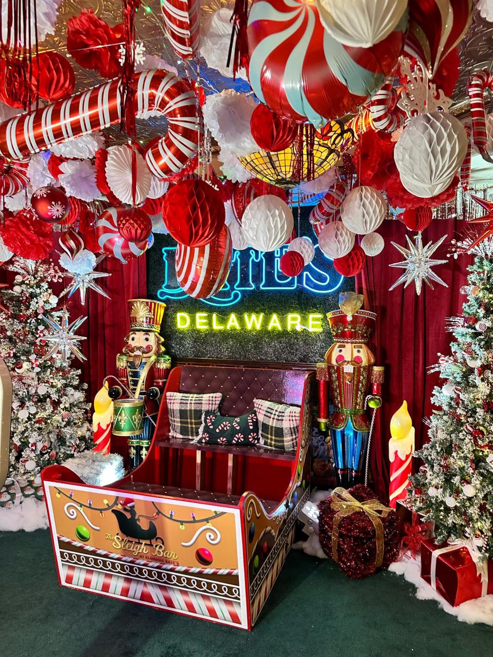 A cozy sled is a popular spot for photos at the pop-up Sleigh Bar at Klondike Kate's Restaurant & Saloon in Newark.