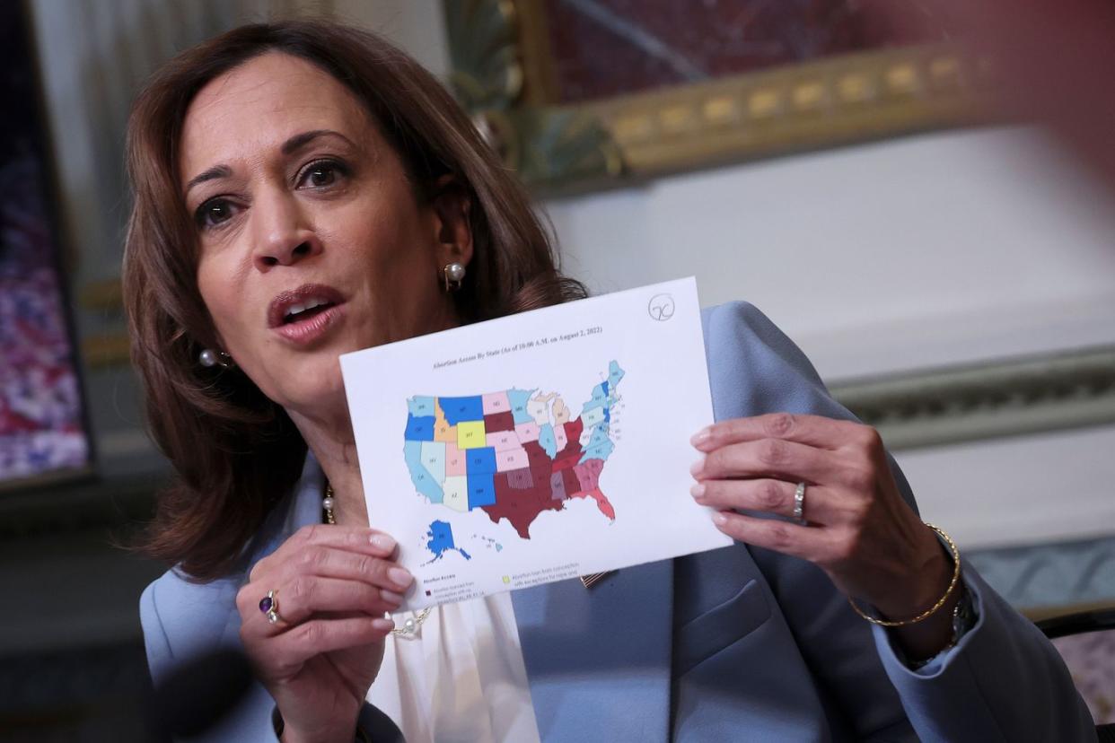 holding a map of the us showing the status of state abortion policies us vice president kamala harris delivers remarks at a meeting of the task force on reproductive healthcare access during an event at the white house