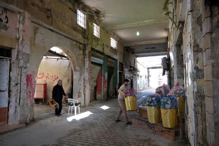 A shopkeeper sells traditional goods at the old popular market known as the Souk al-Jureid, which was destroyed during the war, in Benghazi, Libya February 7, 2019. REUTERS/Esam Omran Al-Fetori