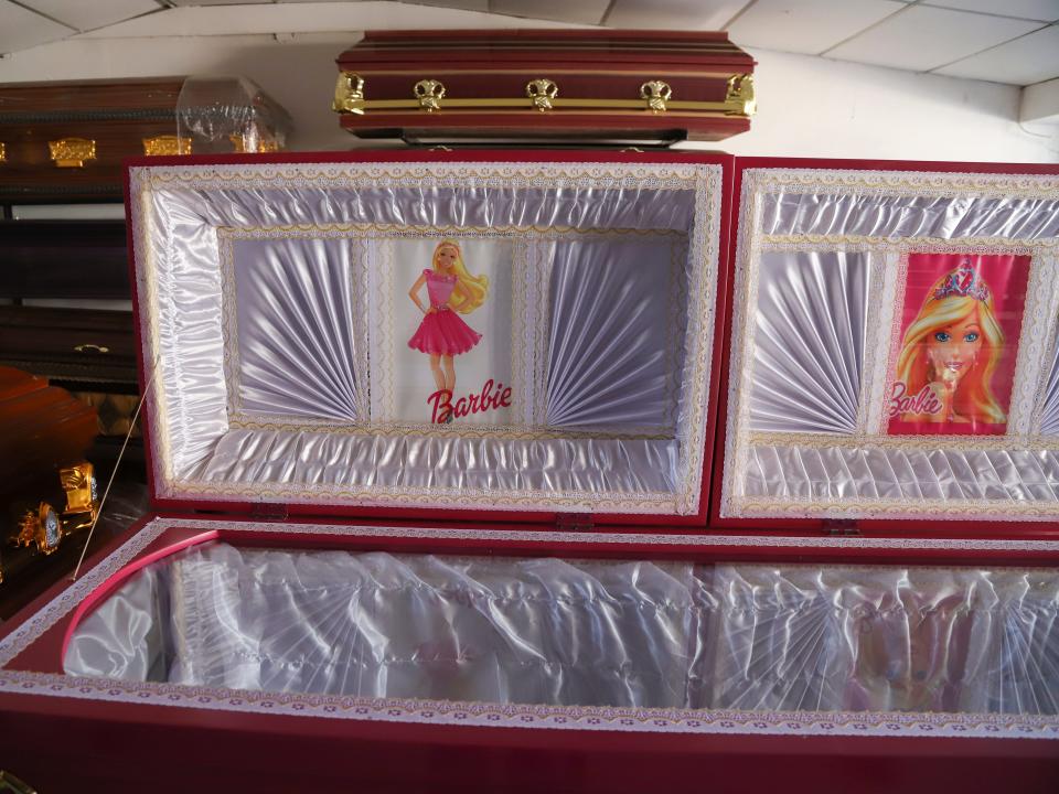 A pink colored coffin featuring a Barbie motif is displayed at a funeral home in Ahuachapan, El Salvador on August 4, 2023.