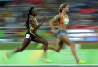 2016 Rio Olympics - Athletics - Semifinal - Women's 200m Semifinals - Olympic Stadium - Rio de Janeiro, Brazil - 16/08/2016. Dafne Schippers (NED) of Netherlands and Elaine Thompson (JAM) of Jamaica compete. REUTERS/Gonzalo Fuentes