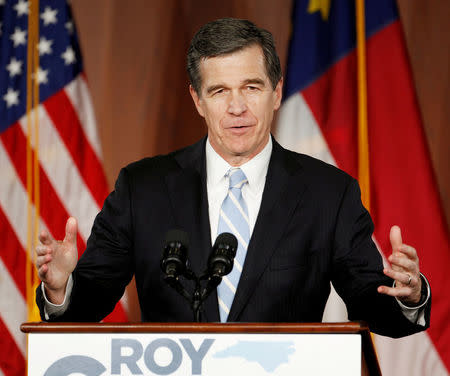 North Carolina Governor-elect Roy Cooper speaks to supporters at a victory rally the day after his Republican opponent and incumbent Pat McCrory conceded in Raleigh, North Carolina, U.S., December 6, 2016. REUTERS/Jonathan Drake/File Photo