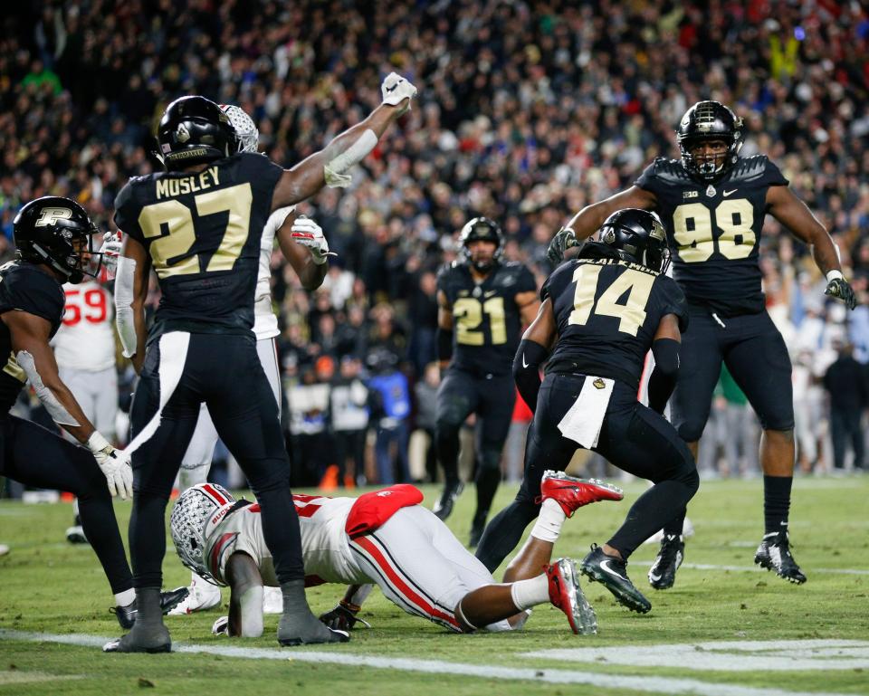 Purdue players celebrate after stopping Ohio State receiver K.J. Hill on fourth-and-goal on Oct. 20, 2018.