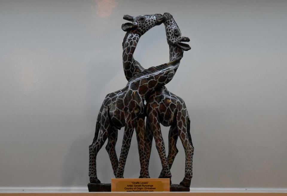 Gerald Runyanga’s “Giraffe Lovers” sculpture is on display at Real African Art in Charlotte.