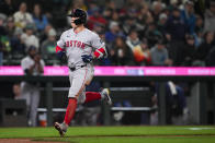 Boston Red Sox's Tyler O'Neill nears home after hitting a home run against the Seattle Mariners during the eighth inning of an opening-day baseball game Thursday, March 28, 2024, in Seattle. (AP Photo/Lindsey Wasson)