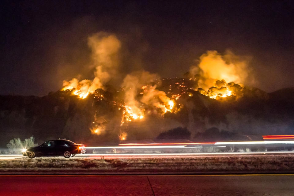 <p>The Thomas Fire burns a hillside south of Casitas Springs, California, on December 6.</p>