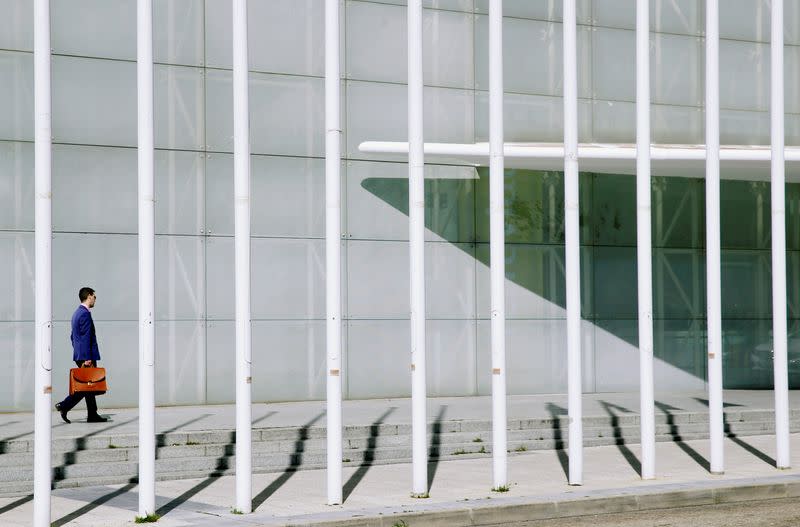 A man enters the municipal congress hall where the Ferrovial general shareholders meeting was taking place in Madrid