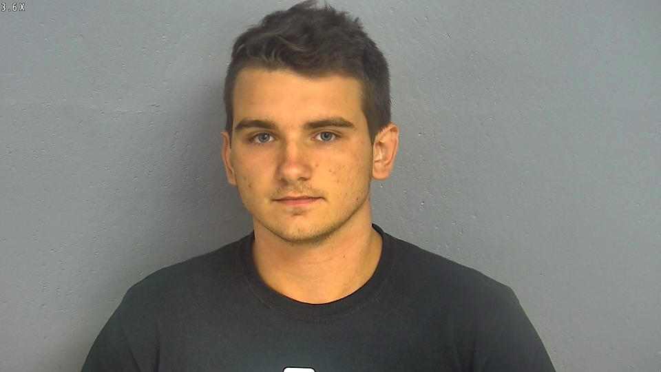 In this undated booking photo provided by the Greene County, Missouri, Sheriff&#39;s Office shows 20-year-old Dmitriy Andreychenko. Five days after 22 people were killed at a Walmart store in El Paso, Texas, panicked shoppers fled a Walmart in Springfield, Missouri, after Andreychenko, carrying a rifle and wearing body armor walked around the store before being stopped by an off-duty firefighter. Police on Friday identified the man as Andreychenko, who lived in the Springfield area. (Greene County Sheriff via AP) .