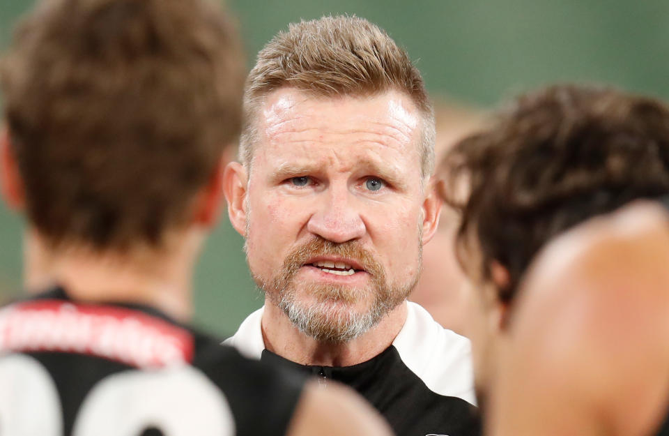 MELBOURNE, AUSTRALIA - JUNE 11: Nathan Buckley, Senior Coach of the Magpies addresses his players during the 2020 AFL Round 02 match between the Collingwood Magpies and the Richmond Tigers at the Melbourne Cricket Ground on June 11, 2020 in Melbourne, Australia. (Photo by Michael Willson/AFL Photos via Getty Images)