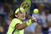 Lloyd Harris, of South Africa, hits a forehand to Rafael Nadal, of Spain, during the Citi Open tennis tournament Thursday, Aug. 5, 2021, in Washington. Harris won 6-4, 1-6, 6-4. (AP Photo/Nick Wass)