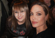 “Angelina Jolie and me. She took my camera and said, ‘here I'll take the picture" WHAAAAT?! ARE YOU KIDDING ME?! Angelina took a picture of us with my camera!!! Wow, she is one of my absolute favorite people. She was SO sweet and so beautiful! Also I just want to thank Brad and Angelina for all the charity work they do. This world is a better place because of these two!”