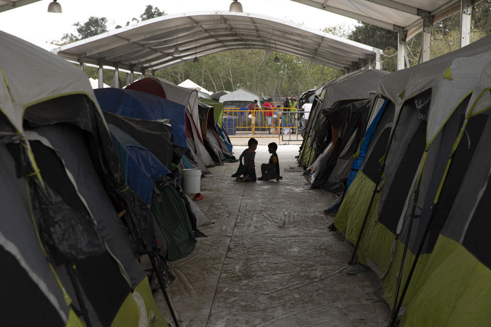 Children play between tents at a makeshift migrant camp in Matamoros, Tamaulipas state, Mexico, on Sunday, March 1, 2020. / Credit: Bloomberg