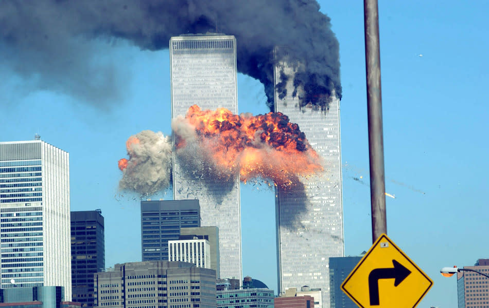 394261 14: A fiery blasts rocks the World Trade Center after being hit by two planes September 11, 2001 in New York City. (Photo by Spencer Platt/Getty Images)