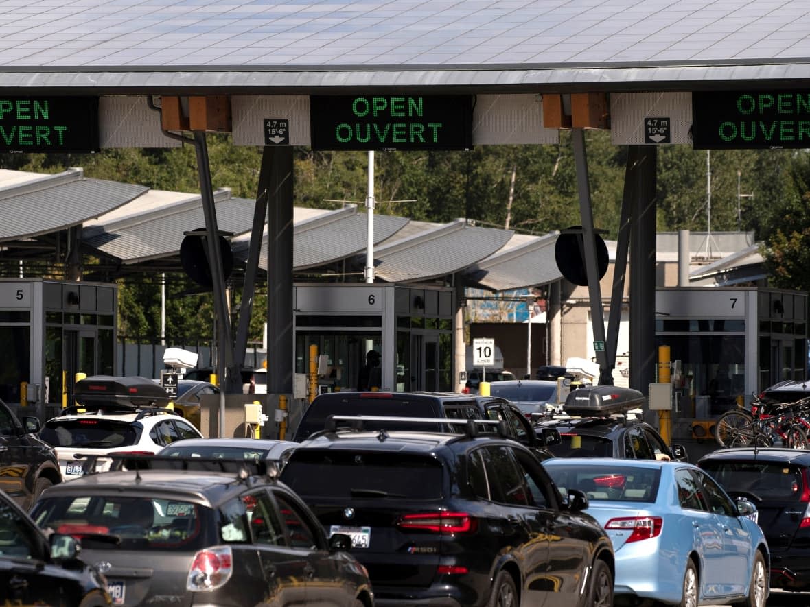 Fully vaccinated British Columbians can now travel across the U.S. land border and back without needing a negative PCR test to return to Canada if they are travelling for less than 24 hours to purchase or access goods and services.  (David Ryder/Reuters - image credit)