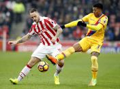 <p>Stoke City’s Marko Arnautovic and Crystal Palace’s Patrick Van Aanholt battle for possession</p>