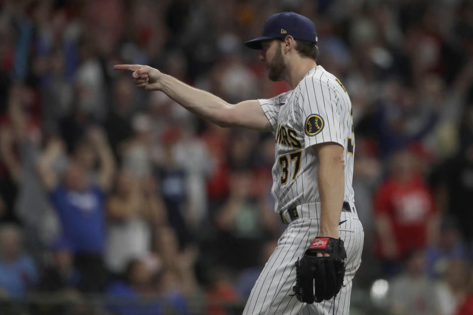 Milwaukee Brewers' Adrian Houser gestures after throwing a complete baseball game shutout during the ninth inning of a against the St. Louis Cardinals Saturday, Sept. 4, 2021, in Milwaukee. (AP Photo/Aaron Gash)