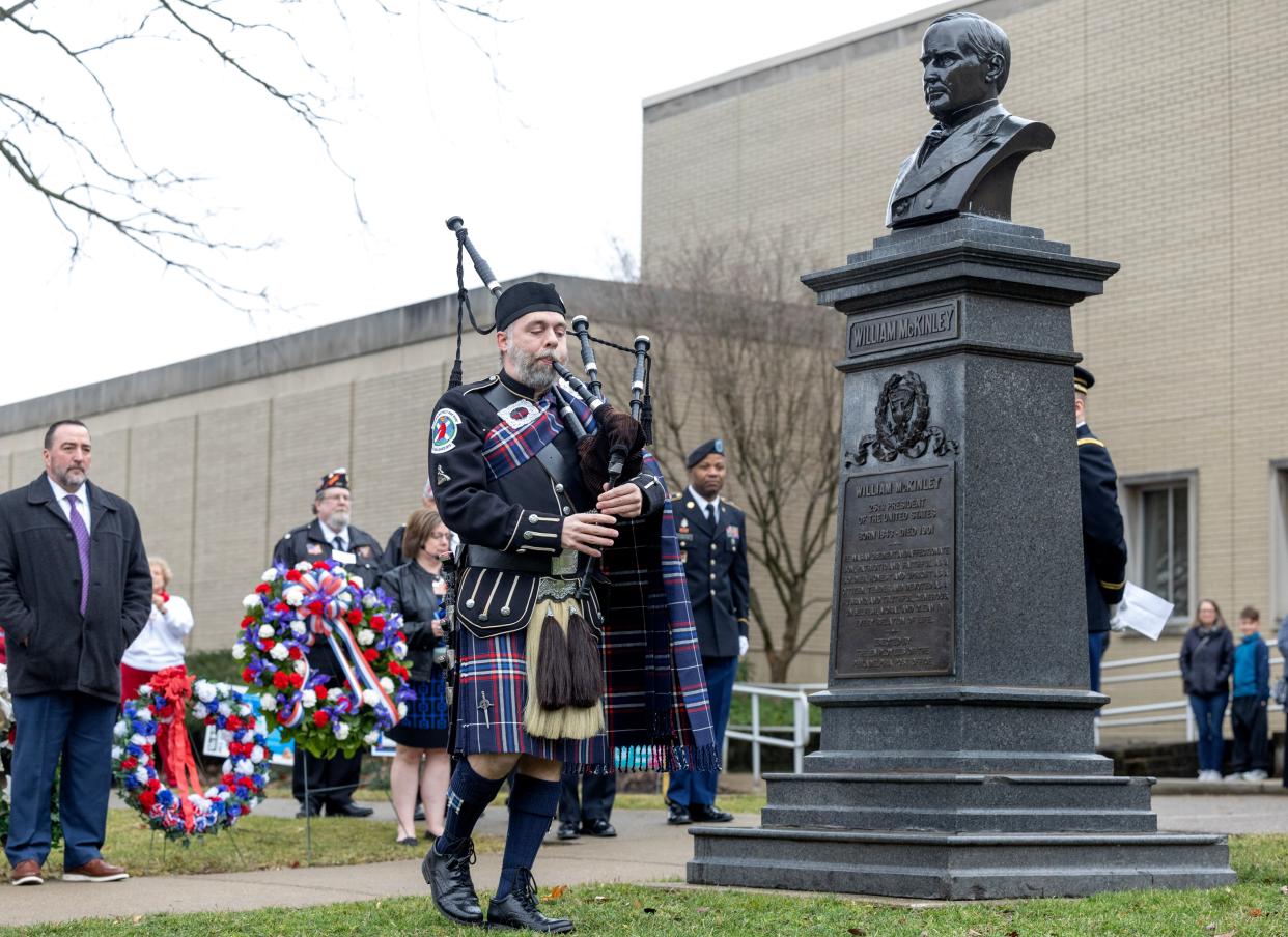 Bagpiper Brian McElhinney opens the William McKinley wreath laying ceremony with a rendition of "Amazing Grace" in Canton on Saturday.