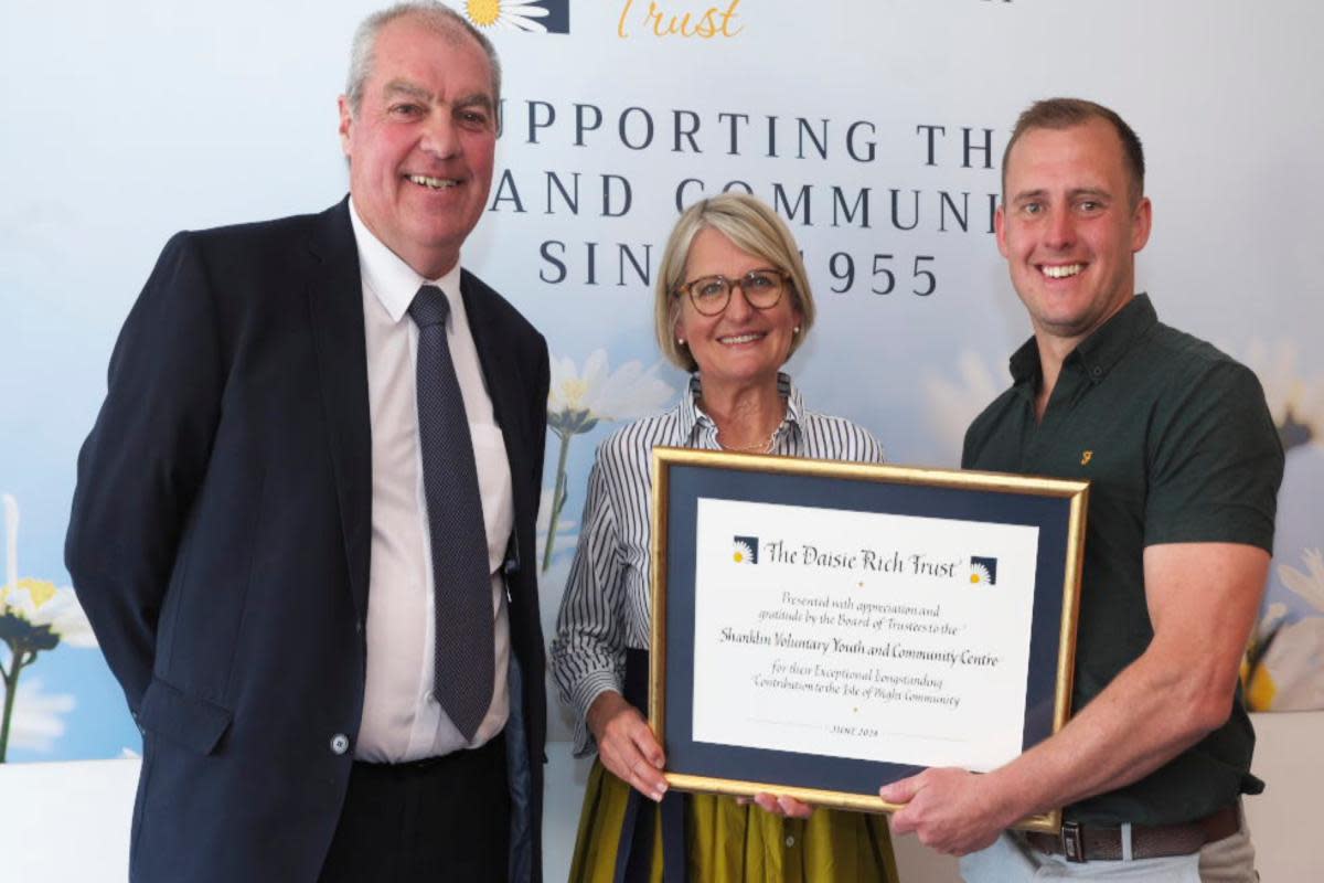 Richard Priest and Mark Biddlecombe handed the SVYCC award by Claire Locke <i>(Image: Contributed)</i>