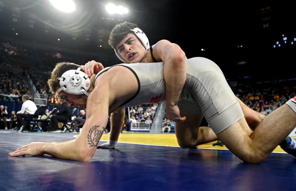 Penn State’s Beau Bartlett controls Ohio State’s Dylan D’Emilio in the 141 lb third place bout of the Big Ten wrestling championships at the Crisler Center on Sunday, March 5, 2023.