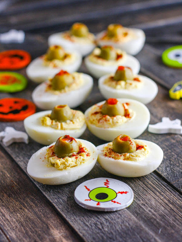 <p>Cotter Crunch</p><p>Devilishly delicious for your dinner table.</p><p><strong>Get the recipe: <a href="http://www.cottercrunch.com/paleo-deviled-egg-eyeballs/" rel="nofollow noopener" target="_blank" data-ylk="slk:Deviled Egg Eyeballs;elm:context_link;itc:0;sec:content-canvas" class="link rapid-noclick-resp">Deviled Egg Eyeballs</a></strong></p><p><strong>Related: <a href="https://parade.com/513911/lindsaylowe/cheap-easy-diy-halloween-decorations/" rel="nofollow noopener" target="_blank" data-ylk="slk:Easy DIY Halloween Decorations;elm:context_link;itc:0;sec:content-canvas" class="link rapid-noclick-resp">Easy DIY Halloween Decorations</a></strong></p>