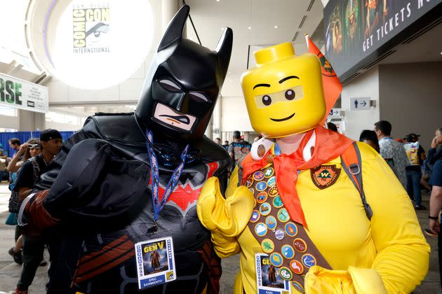 San Diego residents Eric Sarmiento, dressed as Lego Batman, left, and Kari Coulter, dressed as Lego Russell, from the animated film 