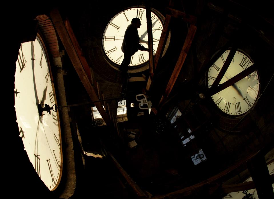 ORG XMIT: KSCR101 Custodian Ray Keen checks the time on a clock face after changing the time on the 97-year-old clock atop the Clay County Courthouse, Saturday, Nov. 6, 2010, in Clay Center, Kan. Keen was setting time back an hour in advance of the end of daylight savings time which occurs at 2 a.m. on Sunday.