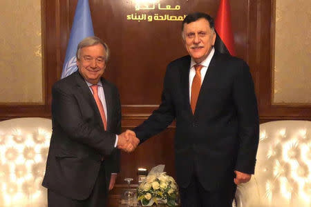 Libyan Prime Minister Fayez al-Sarraj shakes hands with Secretary General of the United Nations Antonio Guterres during the meeting in Tripoli, Libya April 4, 2019. The Media Office of the Prime Minister/Handout via REUTERS