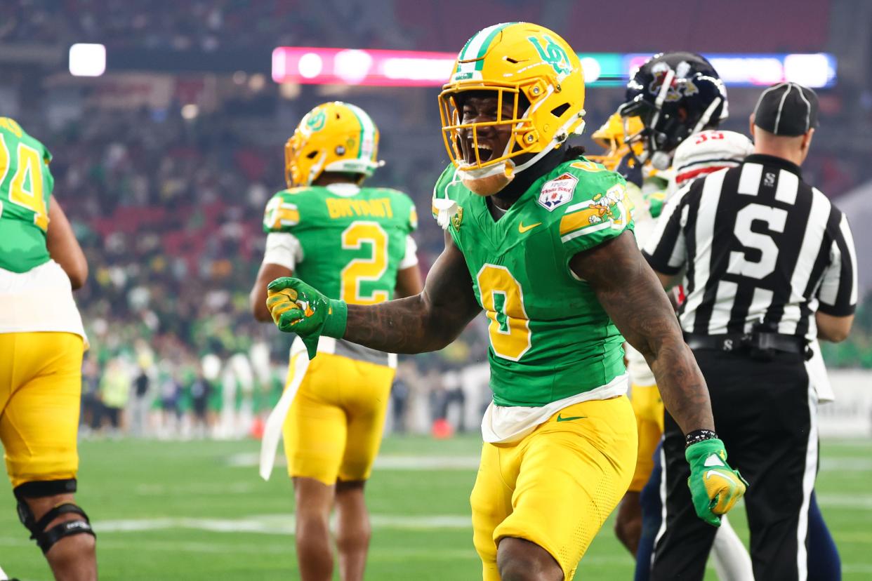 Oregon Ducks running back Bucky Irving (0) reacts after a play against the Liberty Flames during the first quarter of the 2024 Fiesta Bowl at State Farm Stadium Jan. 1 in Glendale, Arizona.