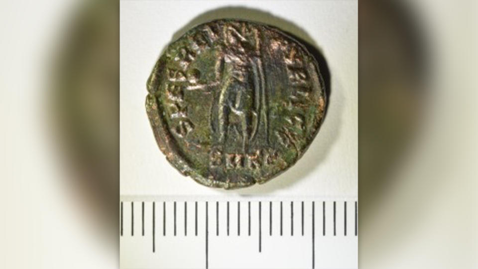 One of the coins discovered on the floor of the destroyed wine shop.