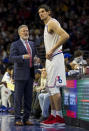 Philadelphia 76ers' head coach Brett Brown, left, talks things over with Boban Marjanovic, right, of Serbia, during the second half of an NBA basketball game against the Los Angeles Lakers, Sunday, Feb. 10, 2019, in Philadelphia. The 76ers won 143-120. (AP Photo/Chris Szagola)